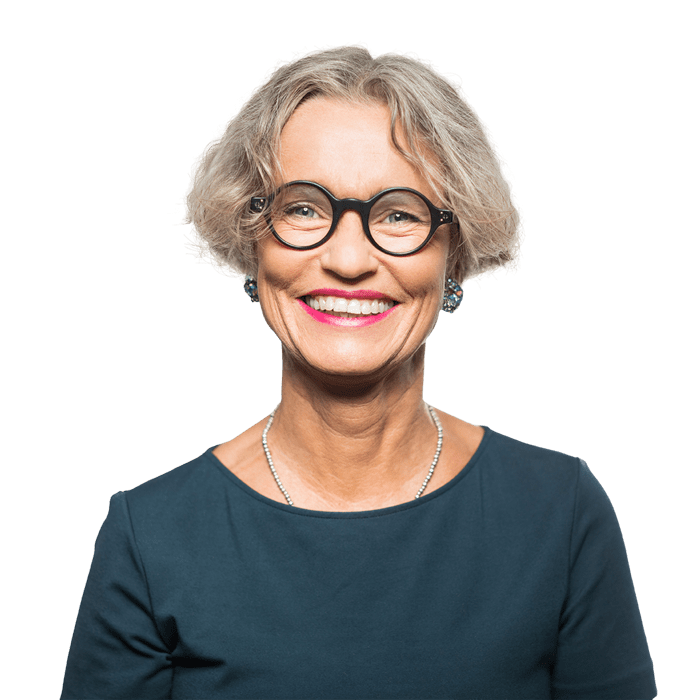 close up headshot of woman in her fifties smiling