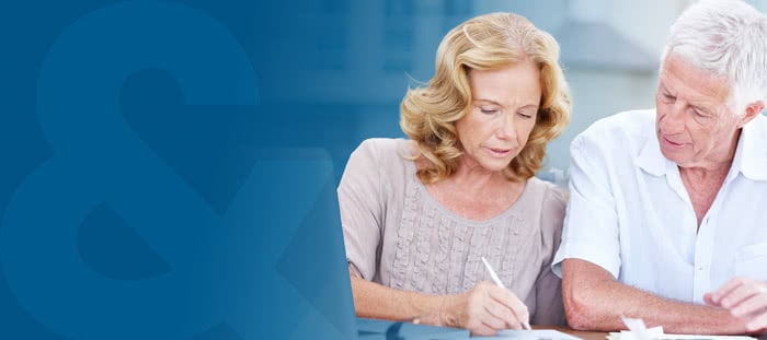 branded blue banner featuring an older couple writing on a piece of paper